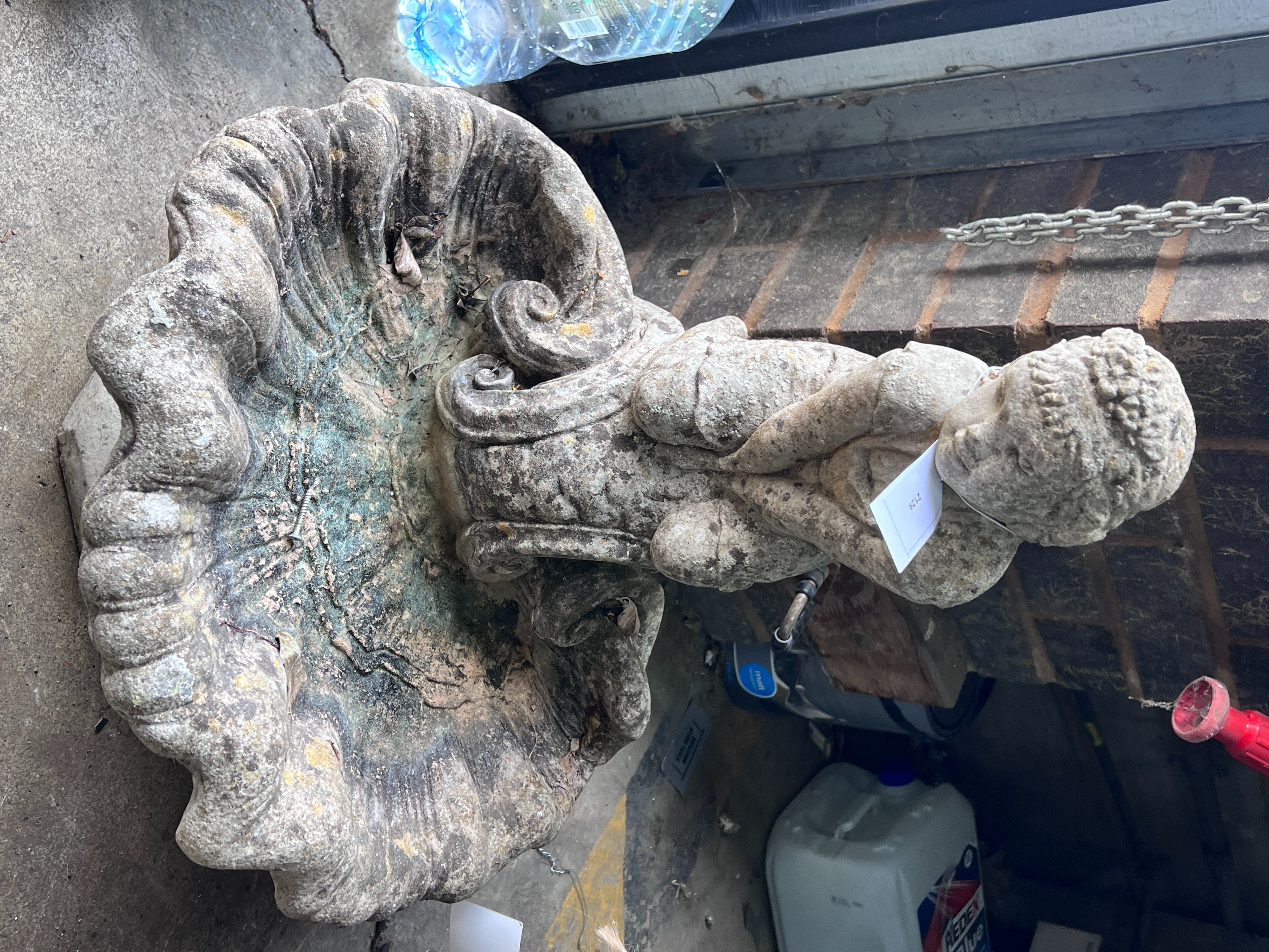 A reconstituted stone figural scallop shell bird bath, height 66cm